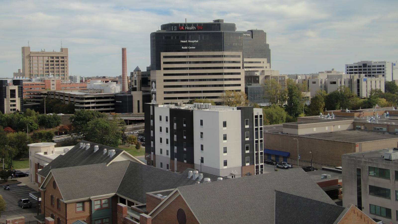 An aerial view of a large hospital building in an urban medical center.